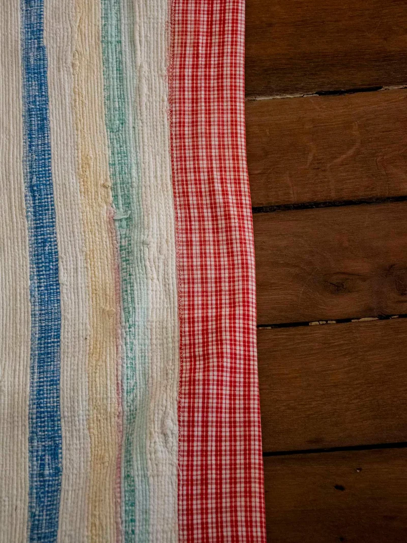Olivier, le tapis au rebord à carreaux N°115