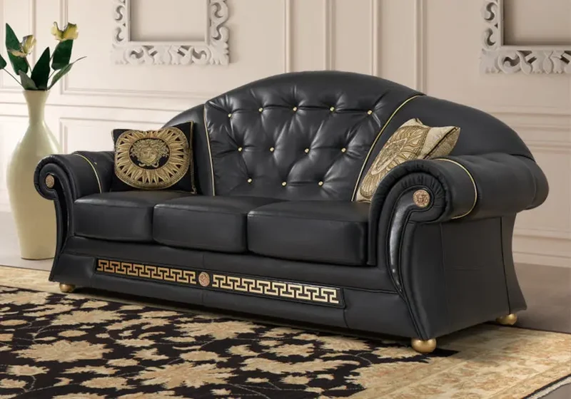 Canapé cuir noir doré capitonné VERSA