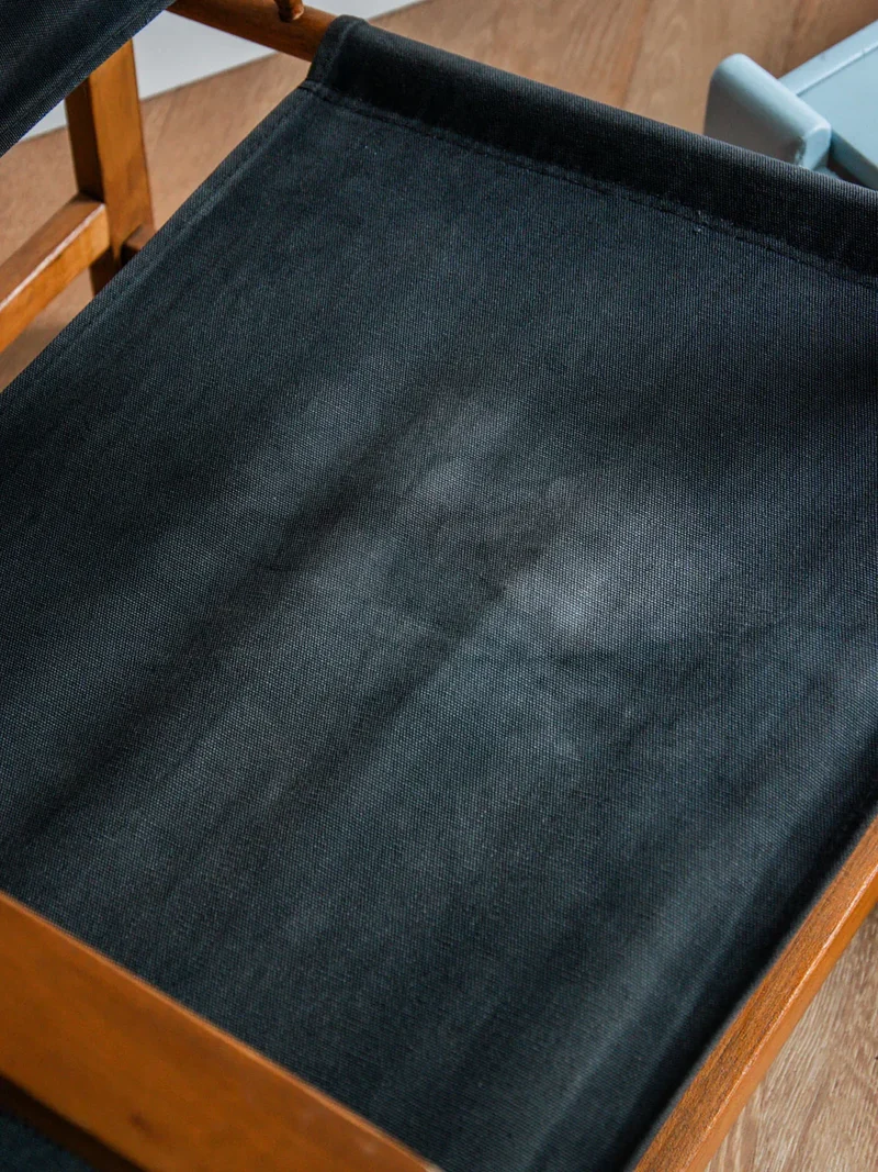 Jakob, le fauteuil en tissu et bois N°517