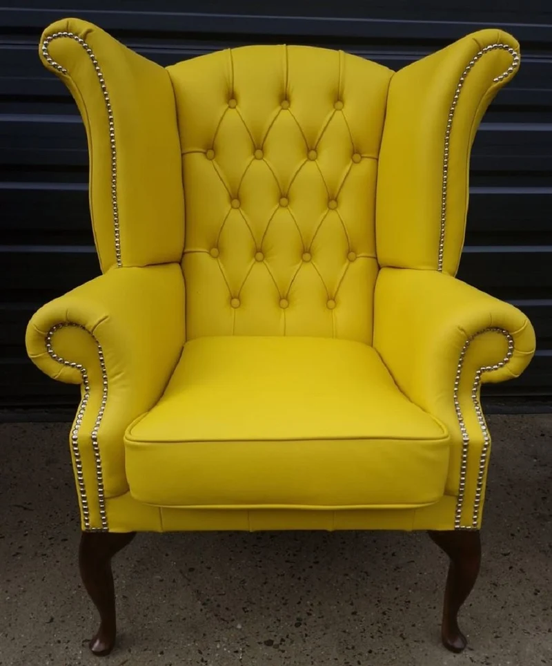 Casa Padrino Luxus Chesterfield Ohrensessel Gelb / Dunkelbraun 98 x 90 x H. 110 cm - Echtleder Chesterfield Wohnzimmer Sessel - Wohnzimmer Möbel - Chesterfield Möbel - Luxus Leder Möbel
