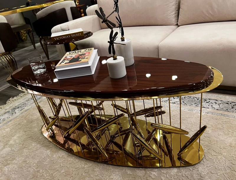 Casa Padrino Luxus Couchtisch Braun / Gold 120 x 51 x H. 47 cm - Ovaler Edelstahl Wohnzimmertisch mit Massivholz Tischplatte - Wohnzimmer Möbel - Hotel Möbel - Luxus Möbel