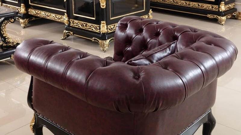 Casa Padrino Luxus Barock Chesterfield Sessel Bordeauxrot / Schwarz / Gold - Prunkvoller Wohnzimmer Sessel mit edlem Kunstleder - Barock Chesterfield Wohnzimmer Möbel