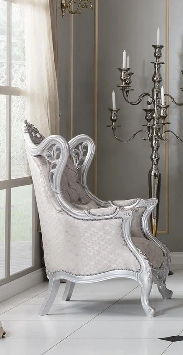 Casa Padrino Luxus Barock Ohrensessel Champagnerfarben / Silber 85 x 80 x H. 120 cm - Prunkvoller Wohnzimmer Sessel mit dekorativem Kissen - Barock Möbel